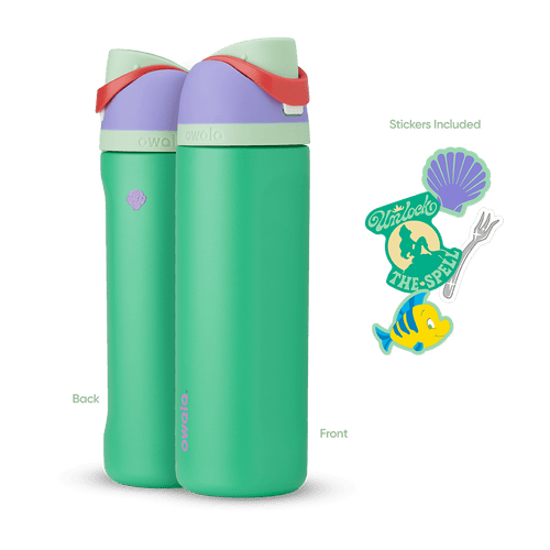 FreeSip 24oz in Ariel, mint green insulated bottle with light lavender flip cap, sage green lid, and red carry loop, shown front and back with included purple shell, "Unlock the Spell" silhouette, fork, and Flounder fish stickers